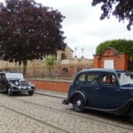 Wolseley Register cars driving round Beamish